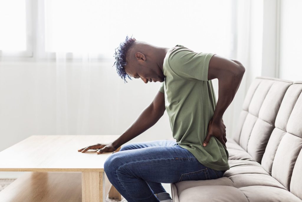 man with back pains scaled e1688244919367